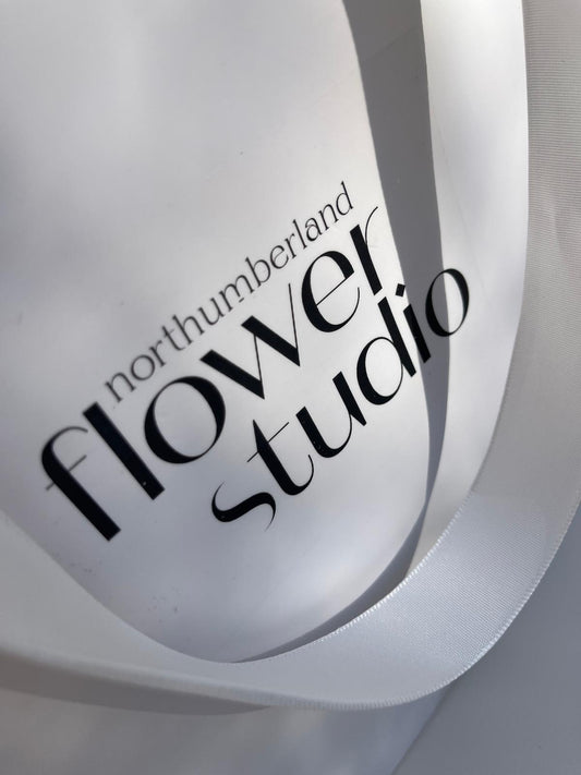 Logo of Northumberland Flower Studio on a white gift bag