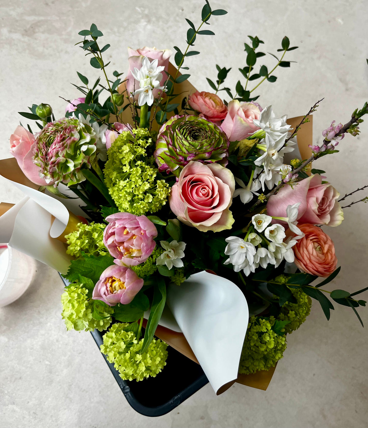 Bucket of colourful spring flowers 