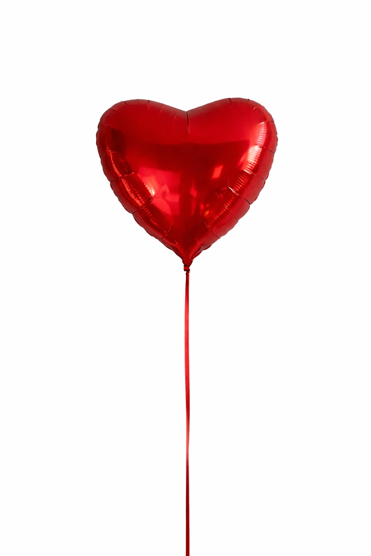 Red heart-shaped balloon on a white background