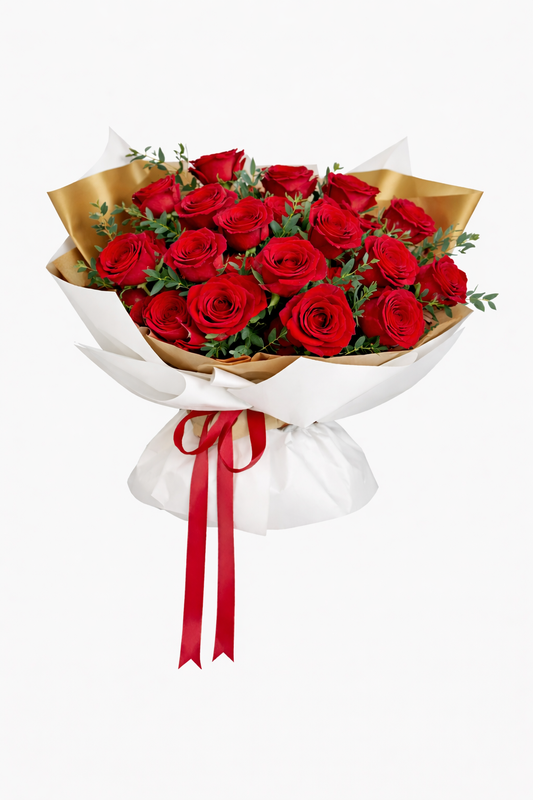 Bouquet of red roses wrapped white paper with a red ribbon on a white background